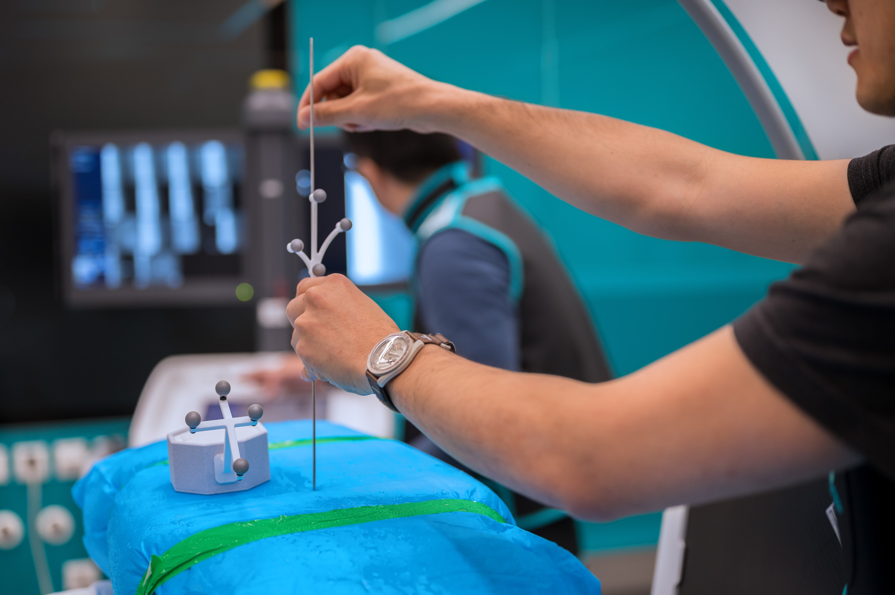 Close-up of a tracked surgical instrument during X23D testing